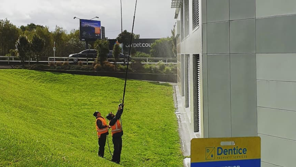 Customer Story_Dentice Property Services_waterblasting the side of a building
