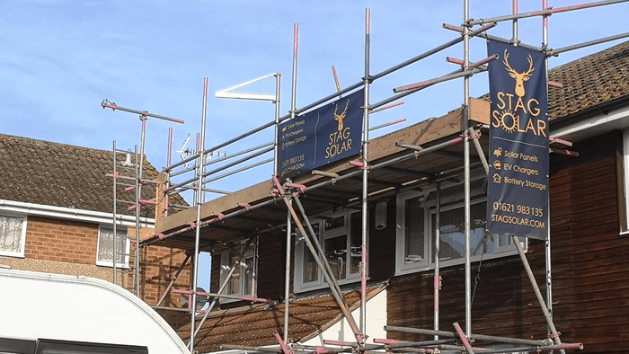 scaffolding at the side of brick and tile building 
