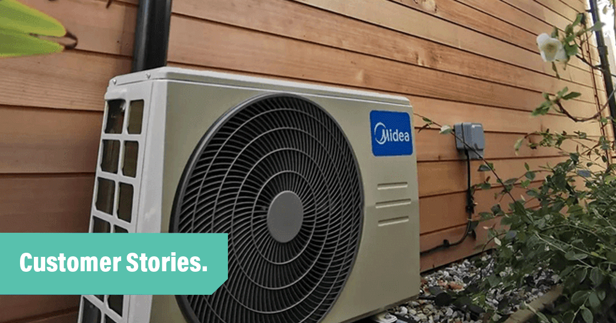 Customer-stories_Island-HVAC-Systems-UK_large-Midea-cooling-unit-by-side-of-wooden-board-house