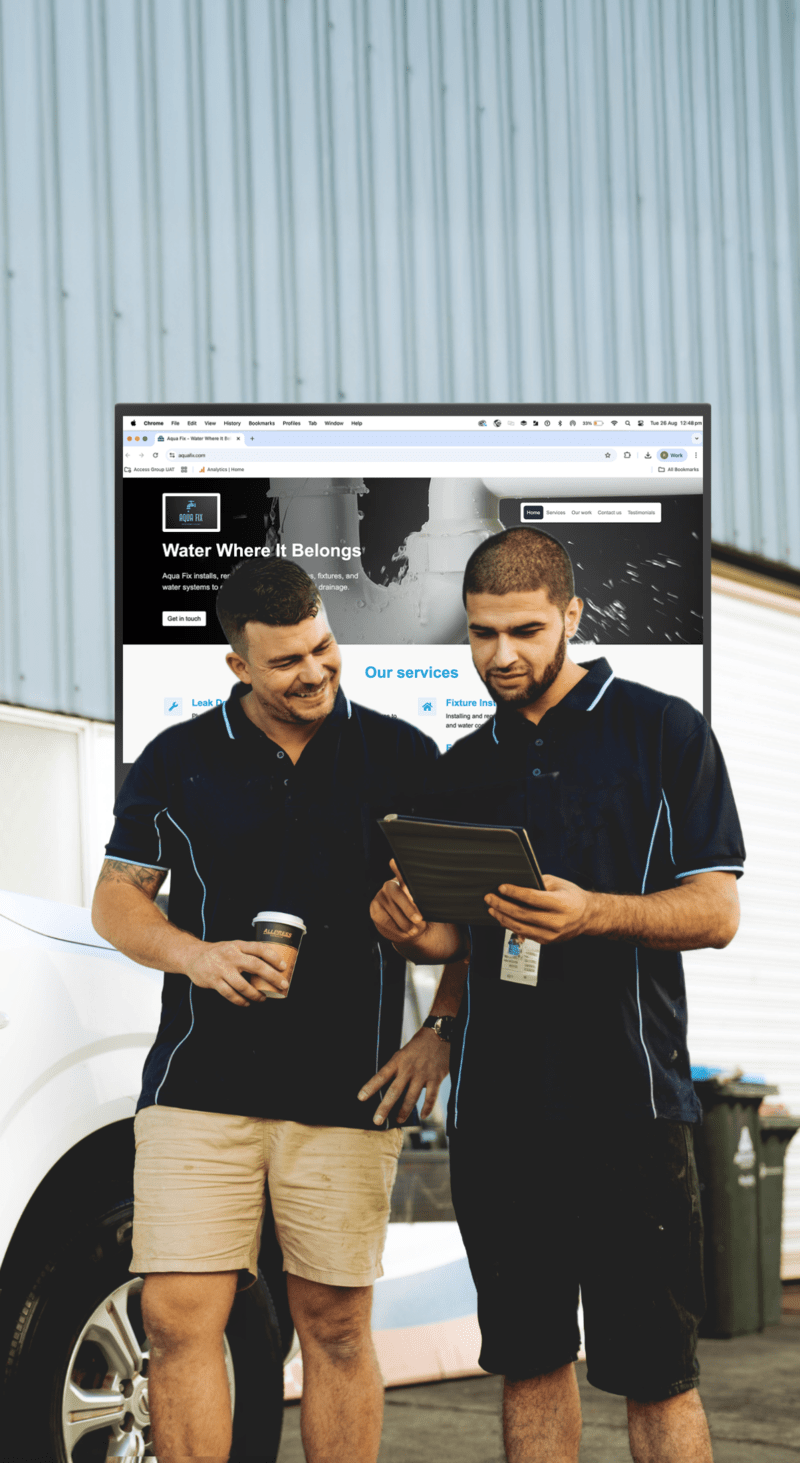 Instant Website shown behind two contractors