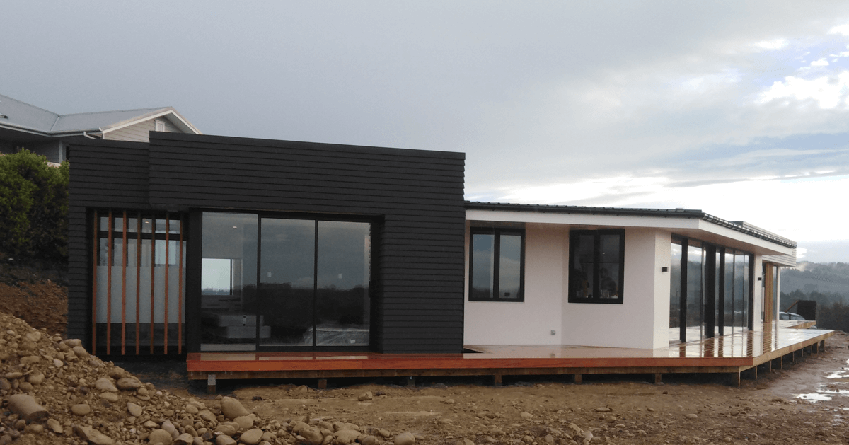 A photo of an apex construction new build of a single level, modern house