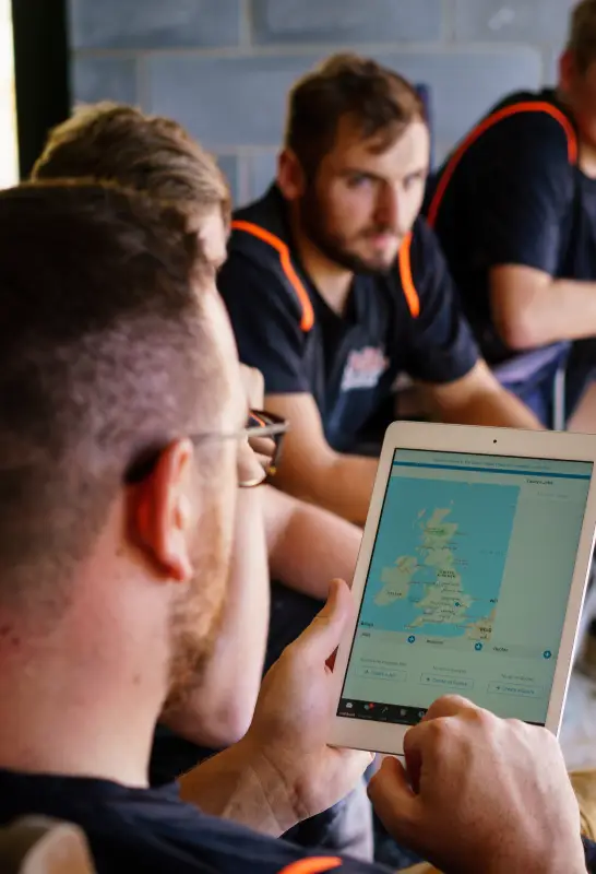 Sectors Image - UK - Tradesperson On Ipad